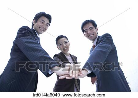 a businessman and a businesswoman shaking their hands View Large Photo Image Stock Image - a businessman and a businesswoman shaking their hands. Fotosearch