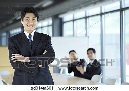 a businessman and his colleagues applausing in a conference room View Large Photo Image Stock Image - a businessman and his colleagues applausing in a conference room. Fotosearch