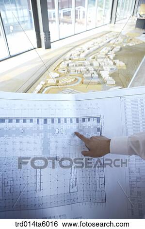 a businessman pointing at something with his finger View Large Photo Image Stock Photograph - a businessman pointing at something with his finger . Fotosearch
