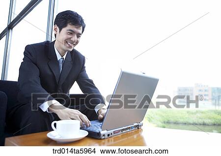 a businessman with a notebook View Large Photo Image Picture - a businessman with a notebook. Fotosearch