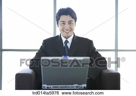 a businessman with a notebook View Large Photo Image Stock Photograph - a businessman with a notebook. Fotosearch