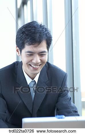 a businessman with a notebook View Large Photo Image Stock Photograph - a businessman with a notebook. Fotosearch