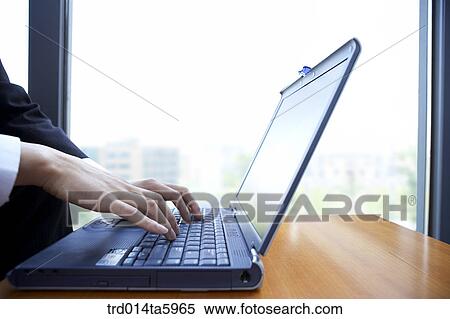 a businessman with a notebook View Large Photo Image Stock Photography - a businessman with a notebook. Fotosearch