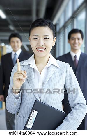 Picture - a businesswoman and a businessman. Fotosearch