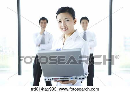a businesswoman with a notebook and a businessman View Large Photo Image Stock Image - a businesswoman with a notebook and a businessman. Fotosearch