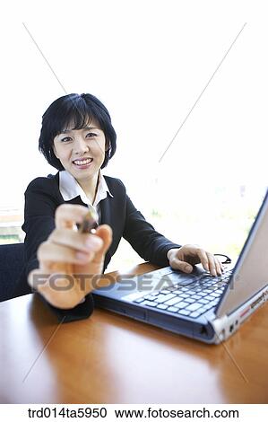 a businesswoman with a notebook View Large Photo Image Stock Image - a businesswoman with a notebook. Fotosearch