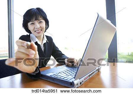 a businesswoman with a notebook View Large Photo Image Stock Image - a businesswoman with a notebook. Fotosearch