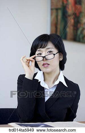 Stock Photo - a businesswoman with glasses. Fotosearch