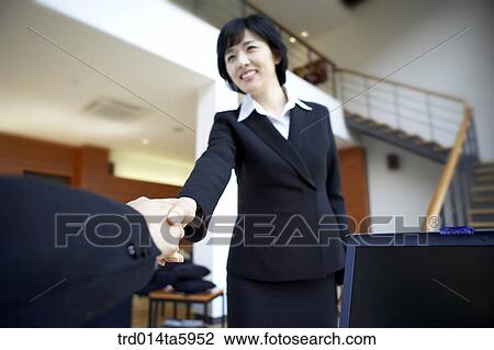 a hands-shaking businesswoman View Large Photo Image Stock Image - a hands-shaking businesswoman . Fotosearch