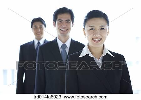Stock Image - a smiling businessman and a businesswoman. Fotosearch
