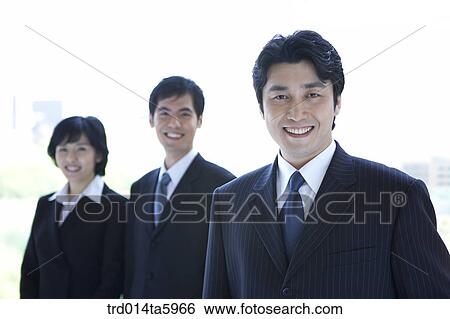 a smiling businessman and a businesswoman View Large Photo Image Stock Photograph - a smiling businessman and a businesswoman. Fotosearch