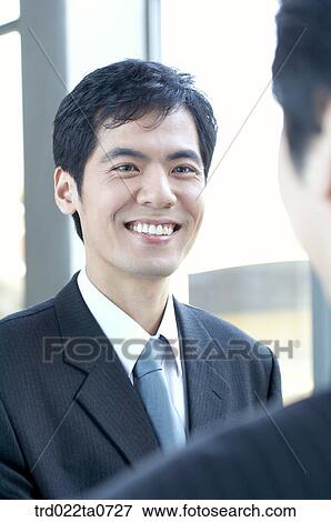 a smiling businessman View Large Photo Image Stock Photo - a smiling businessman. Fotosearch