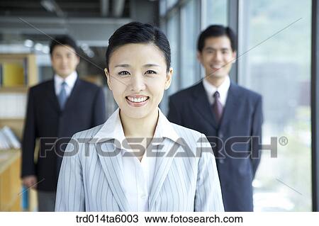 a smiling businesswoman and a businessman View Large Photo Image Stock Image - a smiling businesswoman and a businessman. Fotosearch