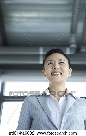 Stock Image - a smiling businesswoman. Fotosearch
