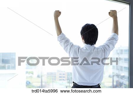 a stretching businessman View Large Photo Image Stock Photograph - a stretching businessman. Fotosearch
