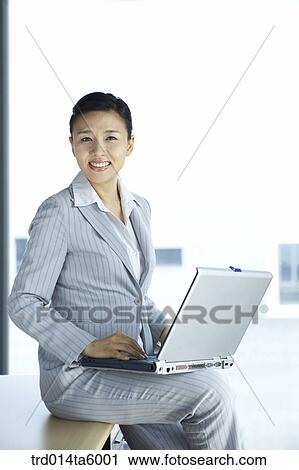 a typing businesswoman View Large Photo Image Stock Image - a typing businesswoman . Fotosearch