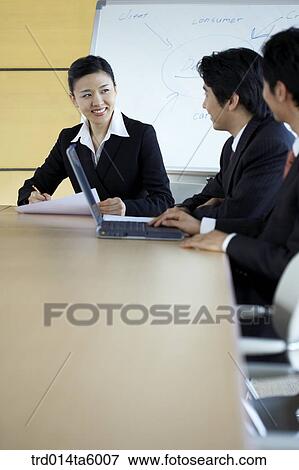 businessmen and businesswomen in a conference room View Large Photo Image Stock Photo - businessmen and businesswomen in a conference room. Fotosearch