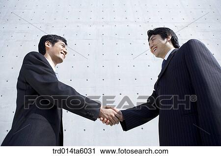 Stock Image - hands-shaking businessmen. Fotosearch