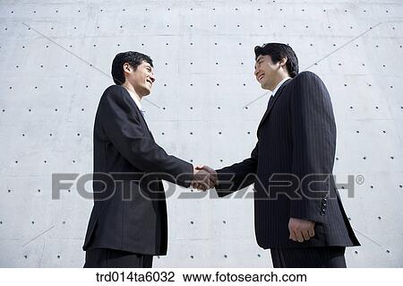 Stock Image - hands-shaking businessmen. Fotosearch