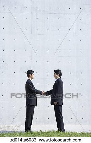 Stock Image - hands-shaking businessmen. Fotosearch