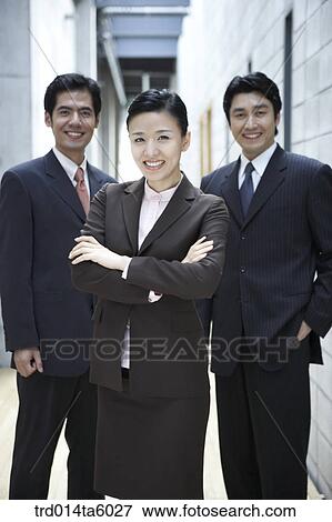 Stock Photo - two businessmen and a businesswoman . Fotosearch