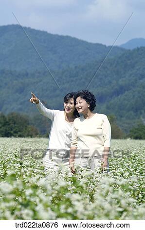 Stock Photograph - day, daytime, old, Asian, daughter, person, outside. Fotosearch