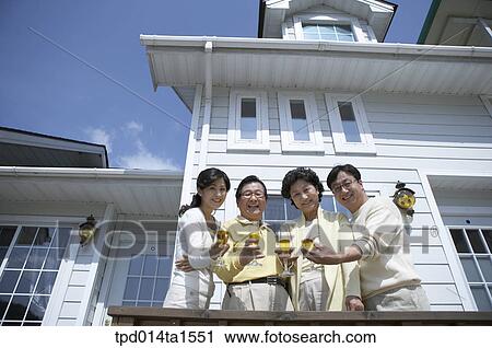 Stock Image - family, cheers, day, daytime, old couple, old. Fotosearch