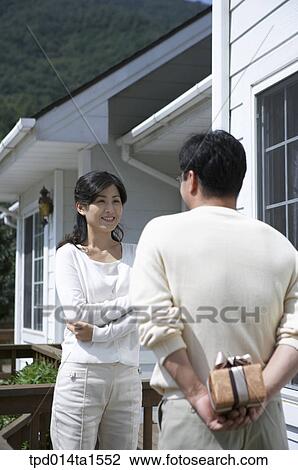 Stock Image - family, day, daytime, Asian, figure from behind, couple. Fotosearch