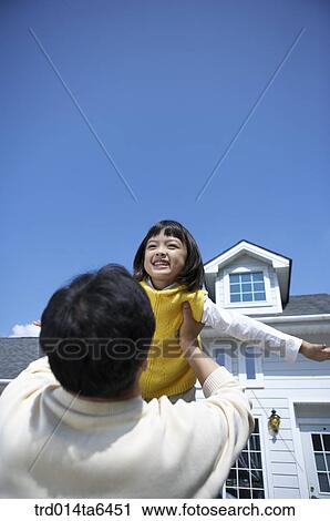 Stock Image - family, day, daytime, Asian, figure from behind, daughter. Fotosearch