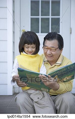 family, day, daytime, old, reading, Asian View Large Photo Image Picture - family, day, daytime, old, reading, Asian. Fotosearch