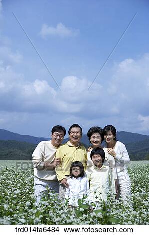 Picture - family, flower garden, brother, sister, day, daytime. Fotosearch
