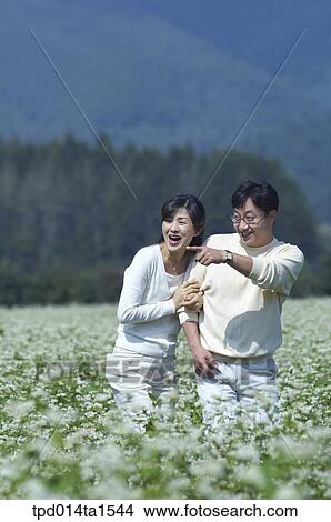 pointing, family, feeling, flower garden, day, daytime View Large Photo Image Picture - pointing, family, feeling, flower garden, day, daytime. Fotosearch