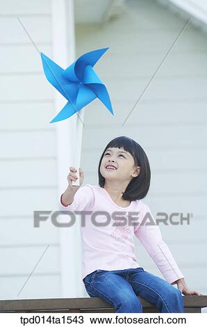 railing, day, daytime, play, Asian, pinwheel, person View Large Photo Image Stock Image - railing, day, daytime, play, Asian, pinwheel, person. Fotosearch