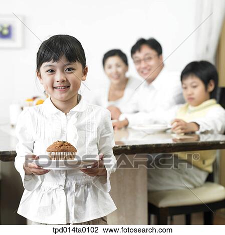 Stock Image - child, muffin, inside, person, bread, Asian. Fotosearch