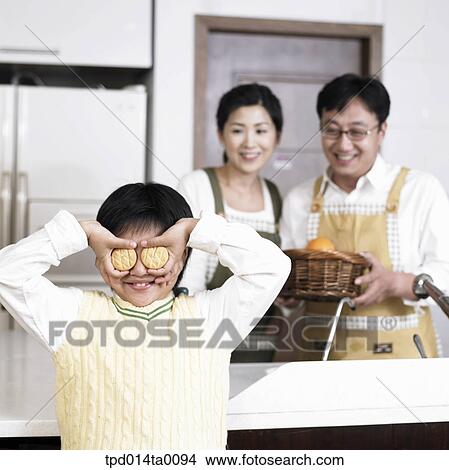 family, snack, Asian, person, inside, child View Large Photo Image Picture - family, snack, Asian, person, inside, child. Fotosearch