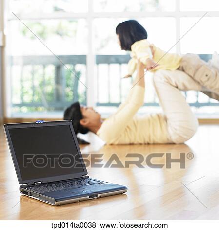 living room, notebook, play, lying, Asian, daughter, airplane View Large Photo Image Stock Photo - living room, notebook, play, lying, Asian, daughter, airplane. Fotosearch