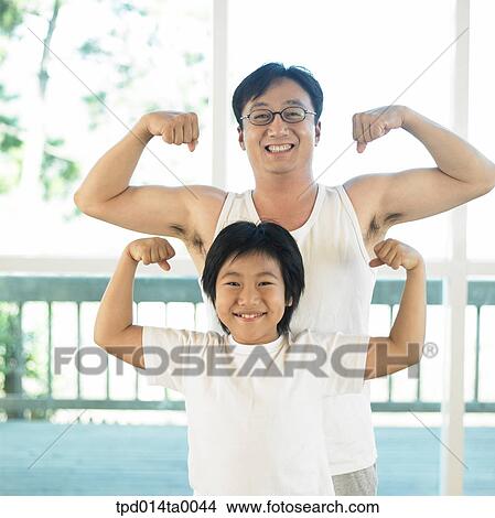 person, father, dad, inside, Asian View Large Photo Image Picture - person, father, dad, inside, Asian. Fotosearch