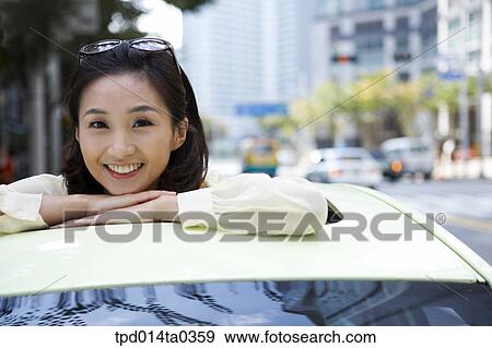 Stock Photo - day, daytime, Asian, person, outside, woman, smile. Fotosearch