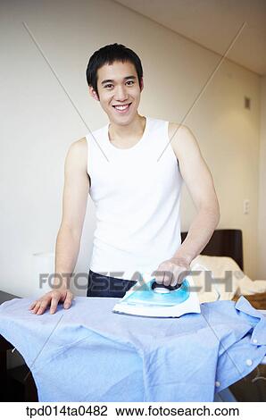 household chores, iron, Asian, person, inside, smile View Large Photo Image Stock Image - household chores, iron, Asian, person, inside, smile. Fotosearch