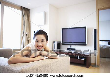 living room, Asian, person, sofa, inside, sitting, leisure View Large Photo Image Stock Image - living room, Asian, person, sofa, inside, sitting, leisure. Fotosearch