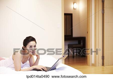 notebook, Asian, person, inside, prostrate, leisure, woman View Large Photo Image Stock Image - notebook, Asian, person, inside, prostrate, leisure, woman. Fotosearch