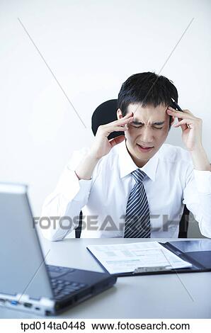 Stock Photo - pain, Asian, business, businessman, person, stress. Fotosearch