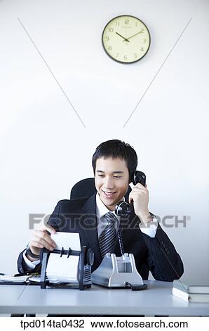 Stock Image - sitting, business, inside, person, businessman, Asian. Fotosearch