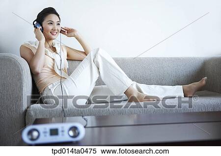 sitting, radio, inside, sofa, person, leisure, Asian View Large Photo Image Stock Photography - sitting, radio, inside, sofa, person, leisure, Asian. Fotosearch