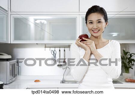 smile, apple, woman, inside, person, middle age, Asian View Large Photo Image Stock Photo - smile, apple, woman, inside, person, middle age, Asian. Fotosearch