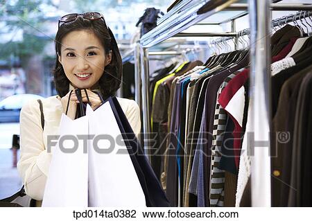 woman, person, inside, shopping bag, shopping, clothing store, Asian View Large Photo Image Stock Image - woman, person, inside, shopping bag, shopping, clothing store, Asian. Fotosearch
