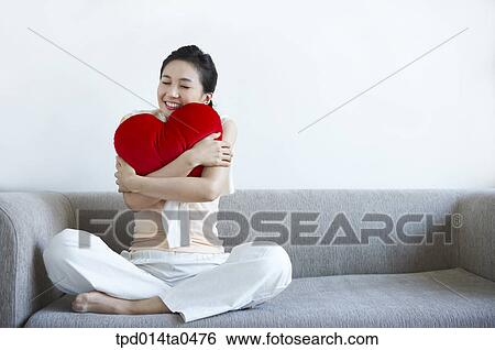 woman, person, sitting, inside, sofa, cushion, Asian View Large Photo Image Stock Photograph - woman, person, sitting, inside, sofa, cushion, Asian. Fotosearch