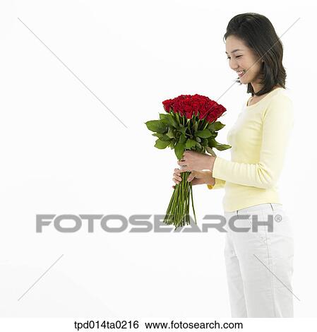 Stock Photograph - bouquet, object, Asian, person, woman, profile, smile. Fotosearch
