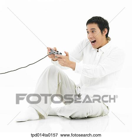 game, object, Asian, person, sitting, entertainment View Large Photo Image Stock Photo - game, object, Asian, person, sitting, entertainment. Fotosearch