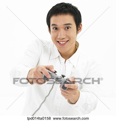 Stock Photo - game, object, Asian, person, entertainment, smile. Fotosearch